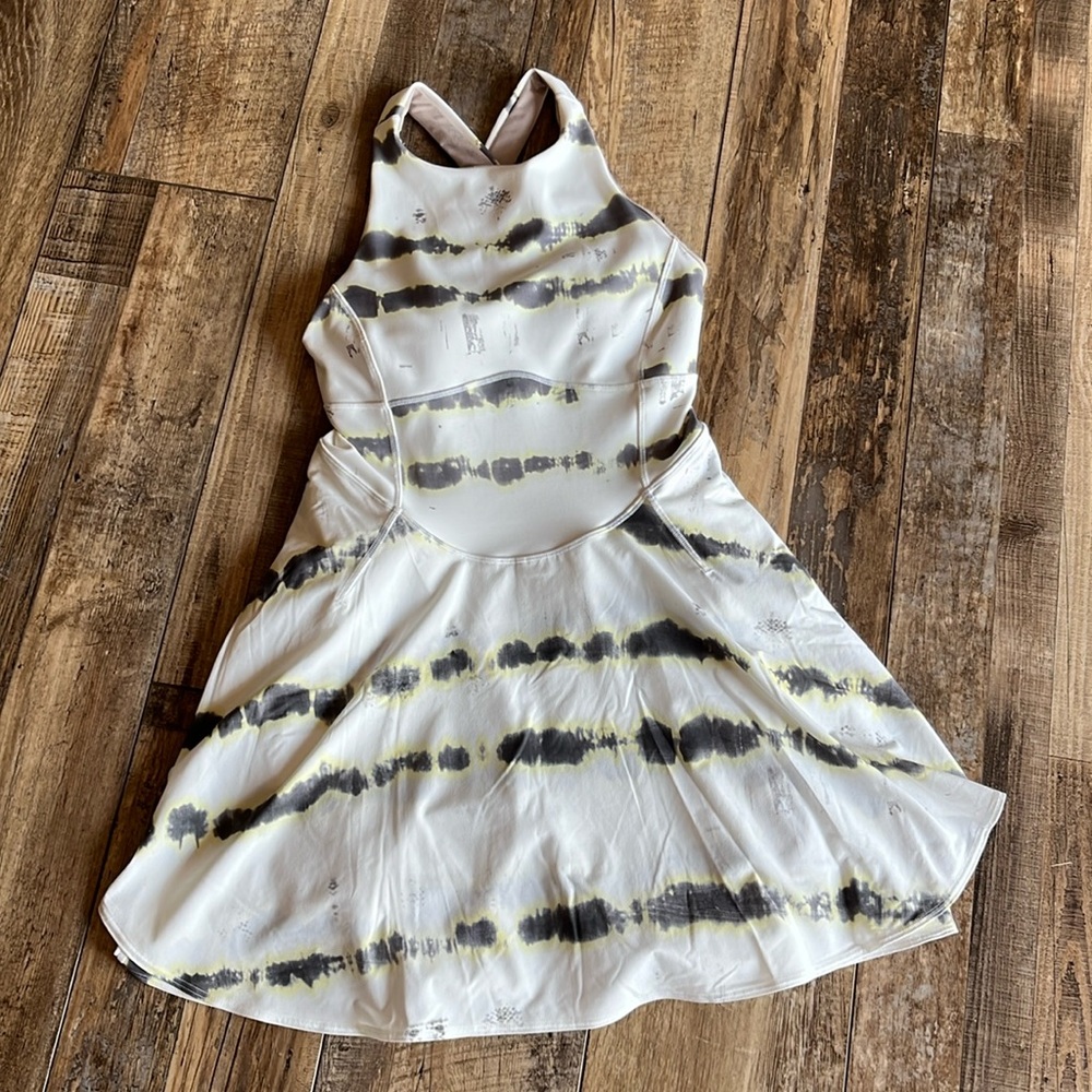 Women’s romper skort. Shorts underneath have pockets, cross strap back.